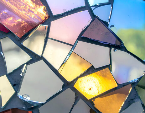 Abstract Mosaic Wall Featuring Multicolored Mirror Shards Reflecting Light in Detailed Close Up