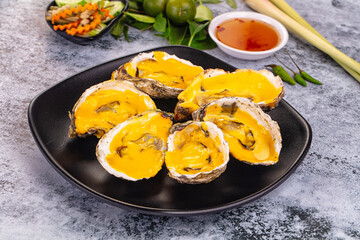Baked oyster with cheddar cheese
