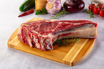 Raw prime beef steak with bone