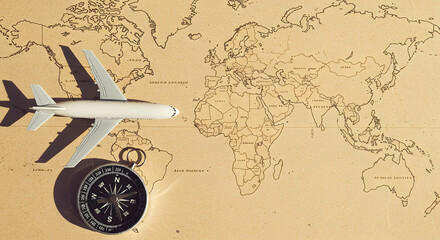 Travel Planning Airplane and Compass on a Vintage World Map Stock Image