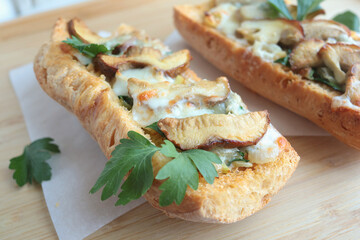 Crostini with porcini mushrooms and cheese. Food and quality products. Traditional cuisine of Italy.