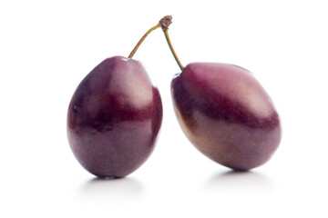 Ripe plums isolated on white background.