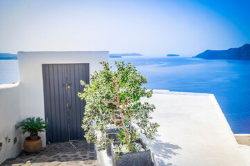 blue gate against volcano caldera, beautiful details of Santorini island, Greece, retro toned