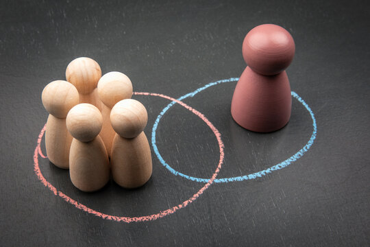 Social exclusion and individuality concept with colored figure and group separation