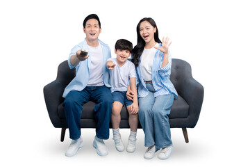 A happy family watching television, sitting together on a couch