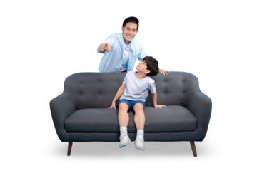 A father pointing at his son sitting on a couch. Father and son share moment of bonding on PNG background