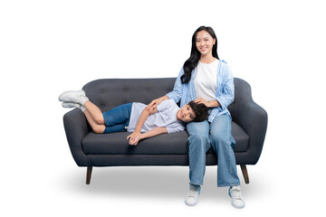 A mother and son are relaxing on a comfortable sofa on PNG background. The mother is seated, and...