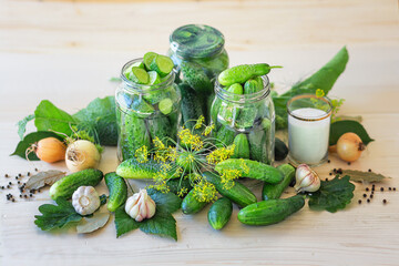 Lightly salted homemade cucumbers in a jar on a wooden background. Pickled cucumbers with dill, garlic and pepper. Canned cucumbers. Cucumbers with dill. Recipe for home canning. Fermented product
