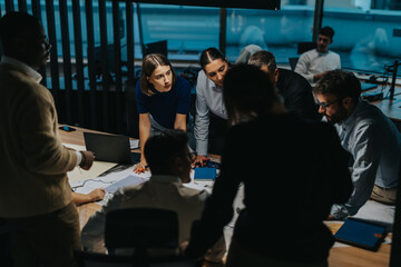 A diverse group of business people engage in a collaborative brainstorming session, focusing on teamwork and creativity. The setting highlights innovation and multigenerational collaboration.