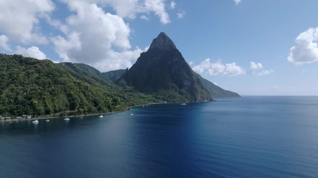 Aerial view of the majestic Pitons mountains rising from the sea, lush green vegetation, small boats dotting the coastline, Le Pitons, Soufri&egrave;re, Saint Lucia.