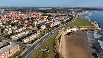 Fototapeta premium Drone Aerial View of Roker Beach, Seaburn Beach, and Roker Pier in Sunderland, Tyne and Wear, North East England, Coastal Landscape from Above