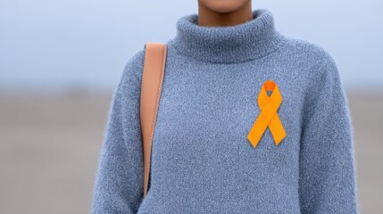Awareness and hope embraced in a cozy sweater on a serene beach during a cloudy day. National Bullying Prevention Month