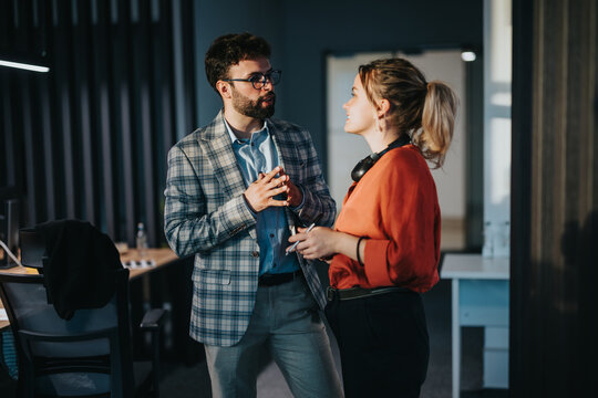 A diverse group of business coworkers engaged in a professional discussion in a modern workspace. The image captures the collaborative spirit among multiracial colleagues.