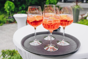 a glasses of aperol spritz at the dinner table.