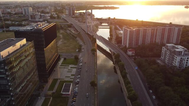 Aerial view of Bucharest office buildings and Dambovita River at sunset