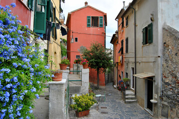 Colorful perspective of a narrow alley in Liguria, Italy