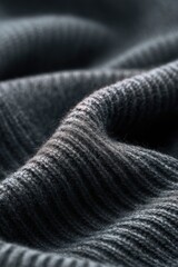 The image features a rich gray knit surface, highlighting the layers and softness of the material for fashion visuals.