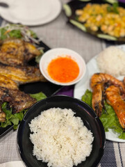 Savory Southeast Asian feast with grilled prawns and fish, perfect for Lunar New Year or Songkran celebration