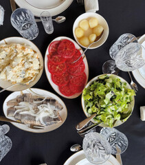 A vibrant Slavic feast of salted herring, beetroot salad, and crystal glassware, evoking Sviatki...