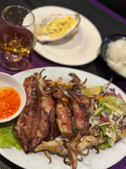 Grilled squid symphony with Thai chili dips, paired with whisky for Lunar New Year feasting and National Seafood Month