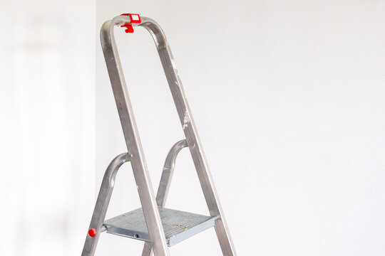 a stepladder in a bright room ready for renovation
