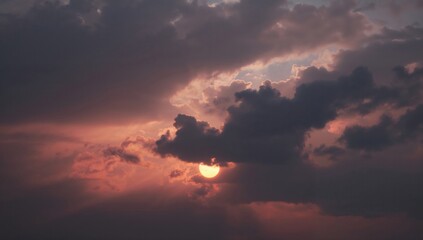 Fototapeta premium Dramatic sunset with vibrant hues of orange and purple clouds, creating a serene yet intense atmosphere