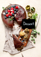 Home made vegan chocolate cake, with cacao and blueberries, healthy dessert recipe, healthy cacao cake with berries.