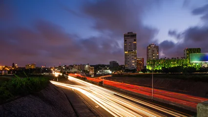 Fototapeten Autobahn In Der Nacht Ghana Accra city skyline at night with light trails.  © Roger