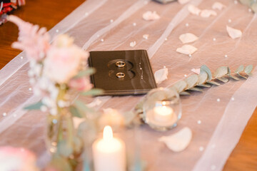 Elegant Wedding Rings on Romantic Table Setting