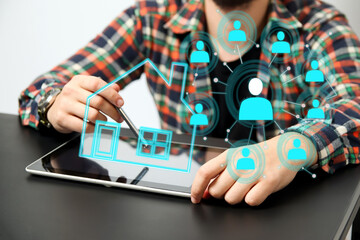 a man using a tablet to analyze digital data for a real estate solution. real estate agent tablet house digital. future of real estate technology concept.