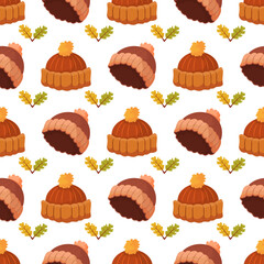 Vector pattern with autumn hats on a white background. Autumn theme.