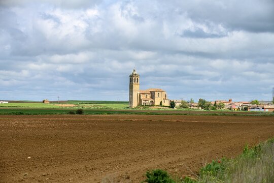 Santa Maria Arbis Church in Baquerin de Campos seen from surrounding farmlands