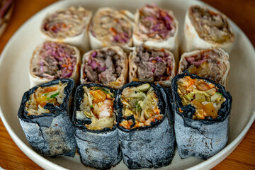 A roll of meat in a special paper. Kebab, a tasty roll with meat.