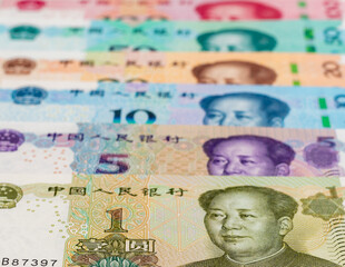 Fototapeta premium Chinese Yuan Banknotes in Different Denominations. Colorful Chinese Currency Notes Closeup with Selective Focus..