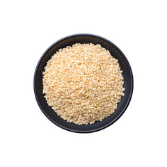 White sesame seeds served on a black plate
