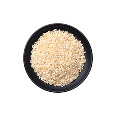 White sesame seeds served on a black plate
