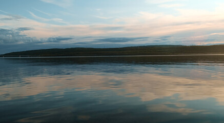 Fototapeta premium Water surface at sunset. Cinematic scenic natural background.