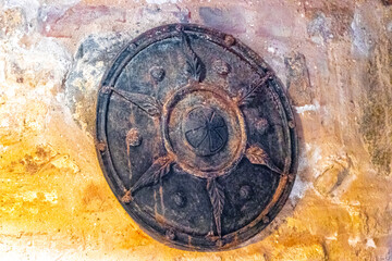 Castle knights shield on brickwall texture in Mir Belarus.