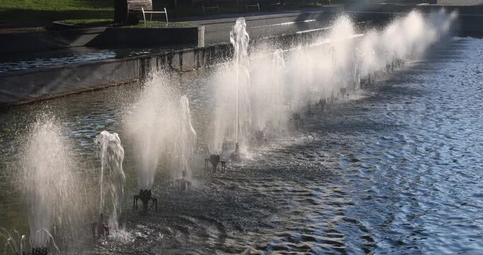 Row of water fountains in a tranquil pond, creating a beautiful and refreshing scene with spray. Bardejov town in North-Eastern Slovakia, Europe.