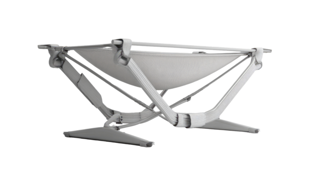Light gray, angular, foldable, structure with a canvas-like interior.  A  triangular  support frame