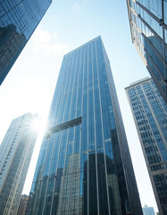 Naklejka premium Modern glass skyscraper with sunlight in business district 