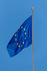European Union flag waving on a tall flagpole