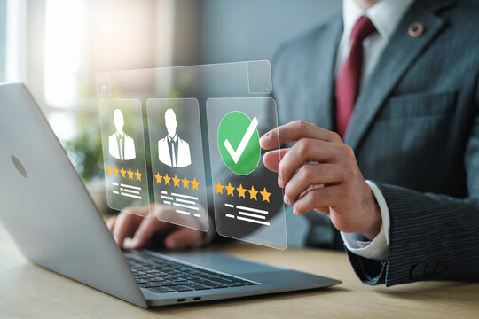 Business professional using a modern laptop to analyze candidate profiles and performance metrics with digital interface showing data visualization and selection process - Powered by Adobe