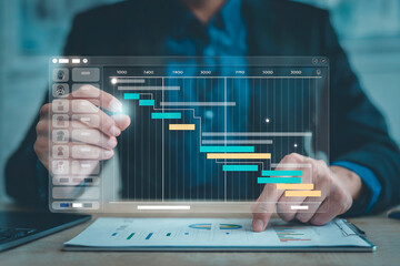 Professional business analyst utilizing advanced digital analytics and data visualization tools to manage project timelines and performance in a modern office setting