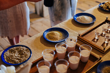 Brewing Ingredients and Tasting Setup on Rustic Table