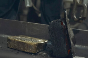 gold bar that has been cleared of slag during solidification.