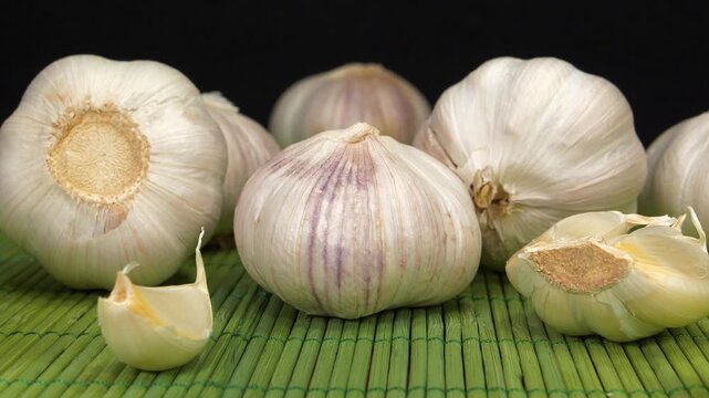 Garlic - very healthy product with many beneficial properties for health. Allium sativum, species of bulbous flowering plants in genus Allium,  zoom-in video