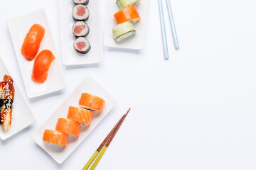 Assorted sushi and maki rolls beautifully arranged on plates