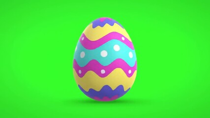 A vibrantly decorated egg stands prominently against a bright green backdrop, showcasing a colorful, zig-zag pattern with multiple hues, creating a festive and cheerful atmosphere.