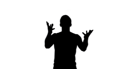 Silhouette of a person with hands raised in a gesturing pose against a black background